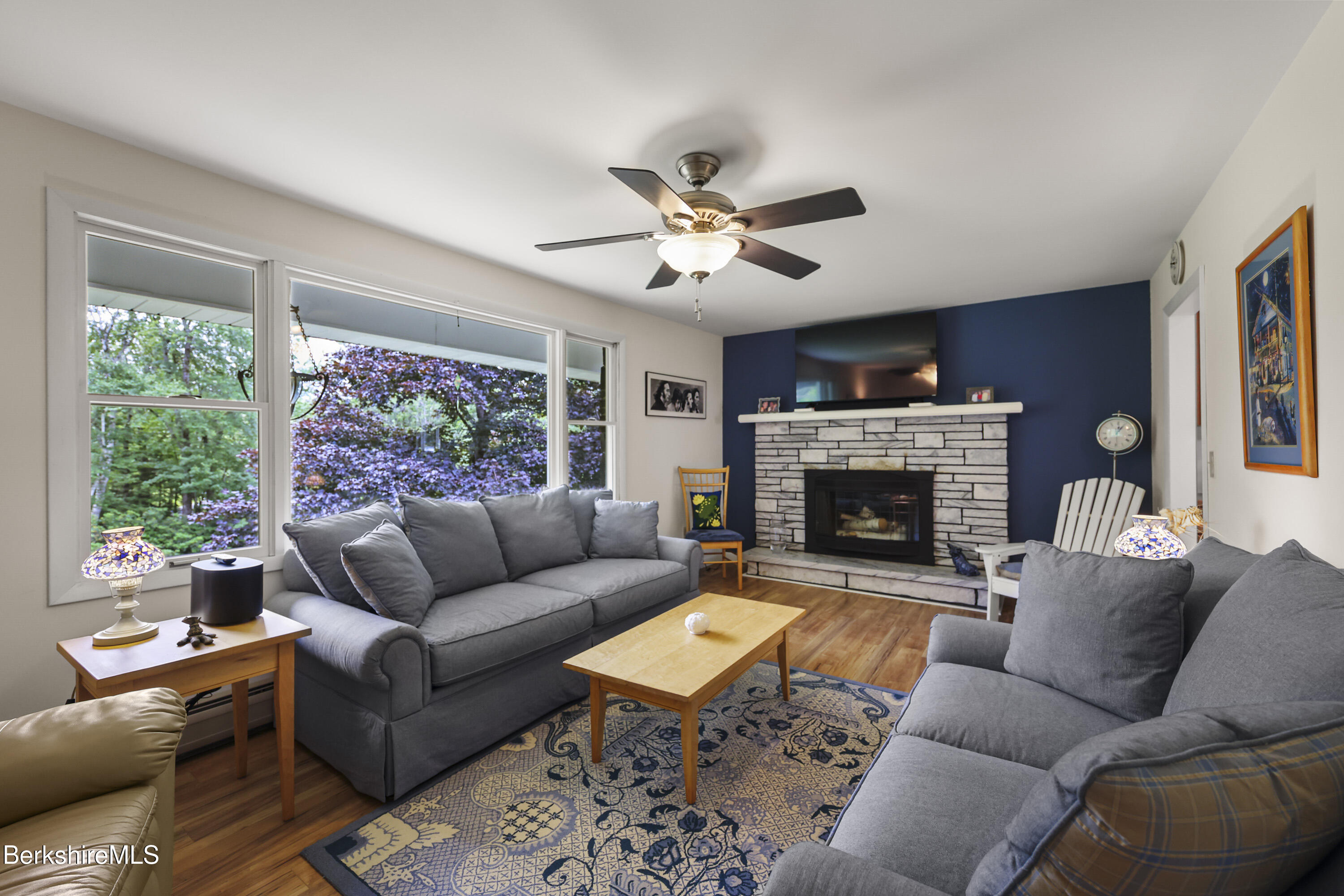 4 Birch Hill Road Peru, MA 01235 - Photo 11 of 76 a living room with furniture fireplace and a large window