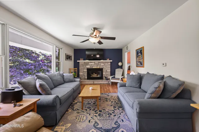 a view of a dining room with furniture and wooden floor