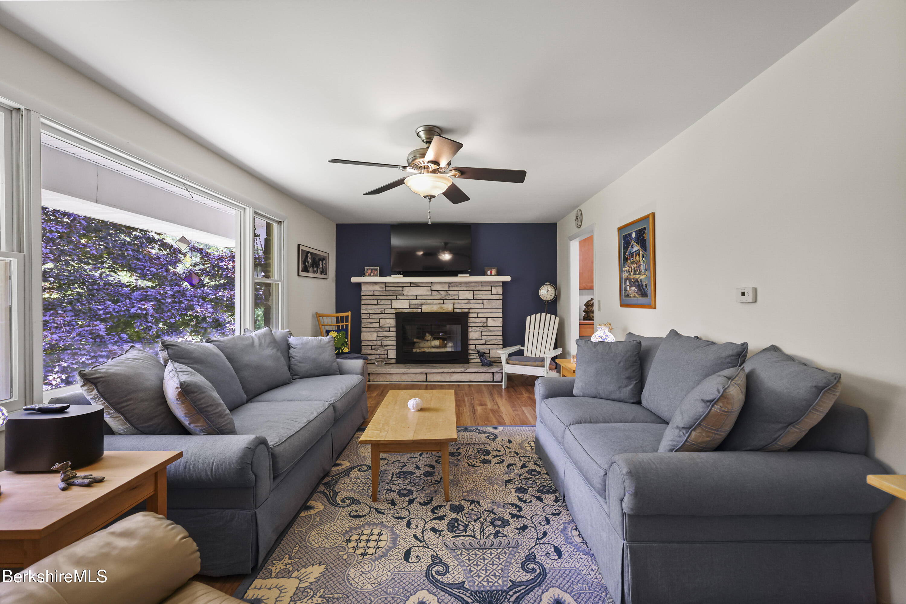 4 Birch Hill Road Peru, MA 01235 - Photo 13 of 76 a living room with furniture a fireplace and a large window