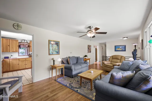 a kitchen with stainless steel appliances kitchen island granite countertop a sink and cabinets