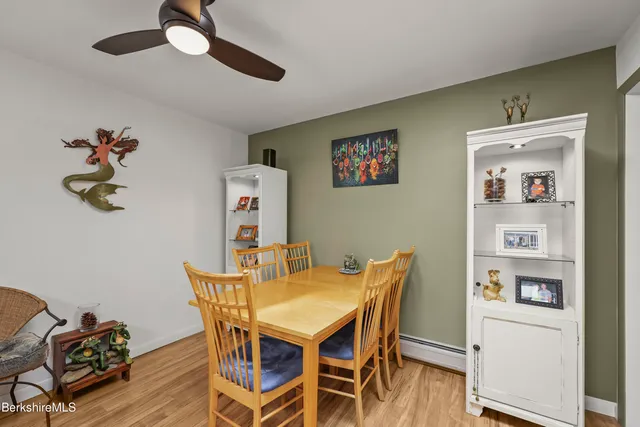 a kitchen with stainless steel appliances granite countertop a sink window and cabinets