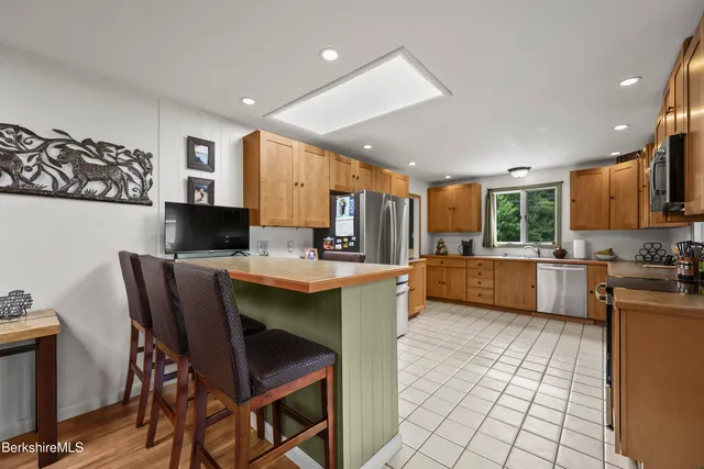 a dining room with furniture water view and wooden floor