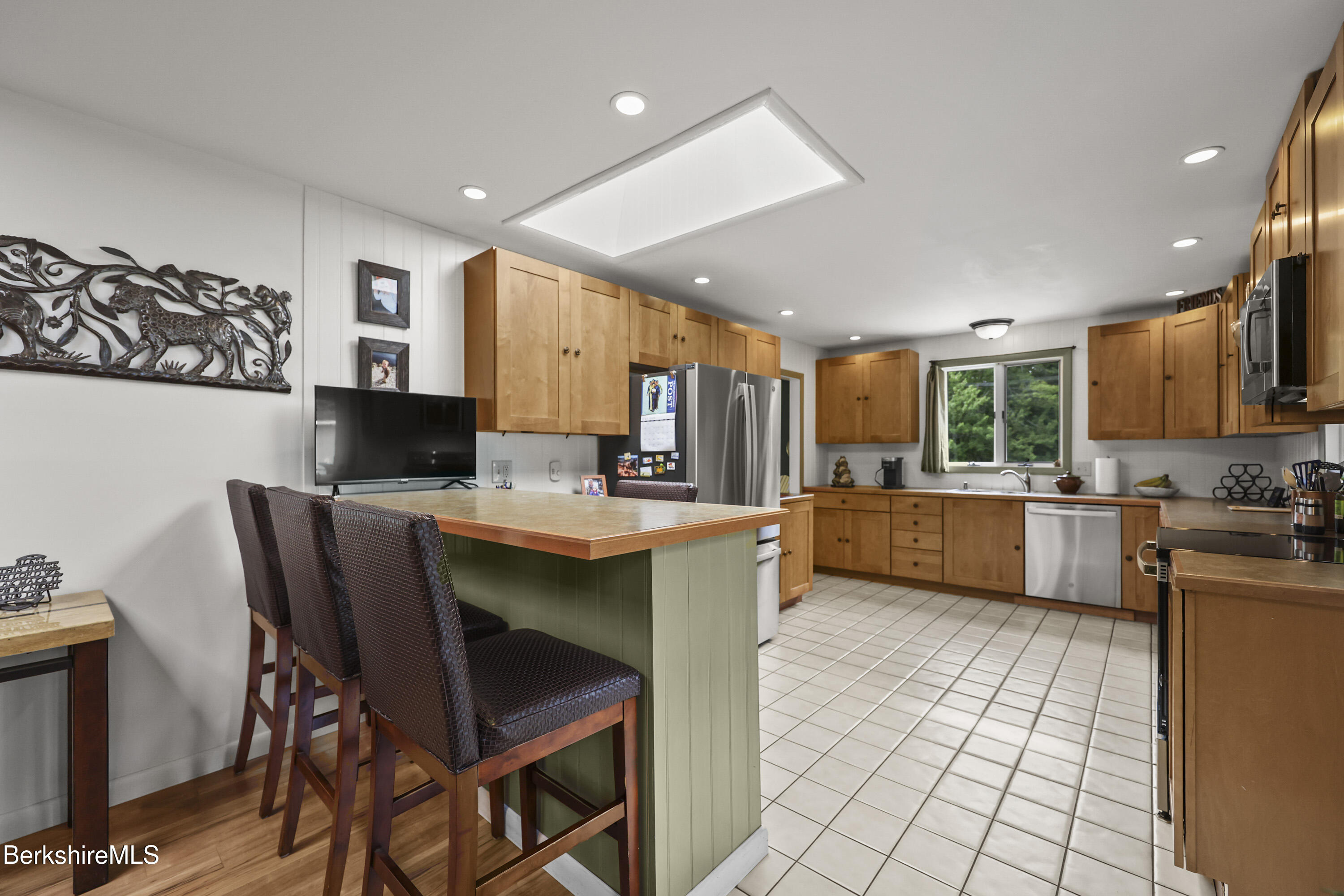 4 Birch Hill Road Peru, MA 01235 - Photo 20 of 76 a kitchen with stainless steel appliances kitchen island granite countertop a sink and cabinets