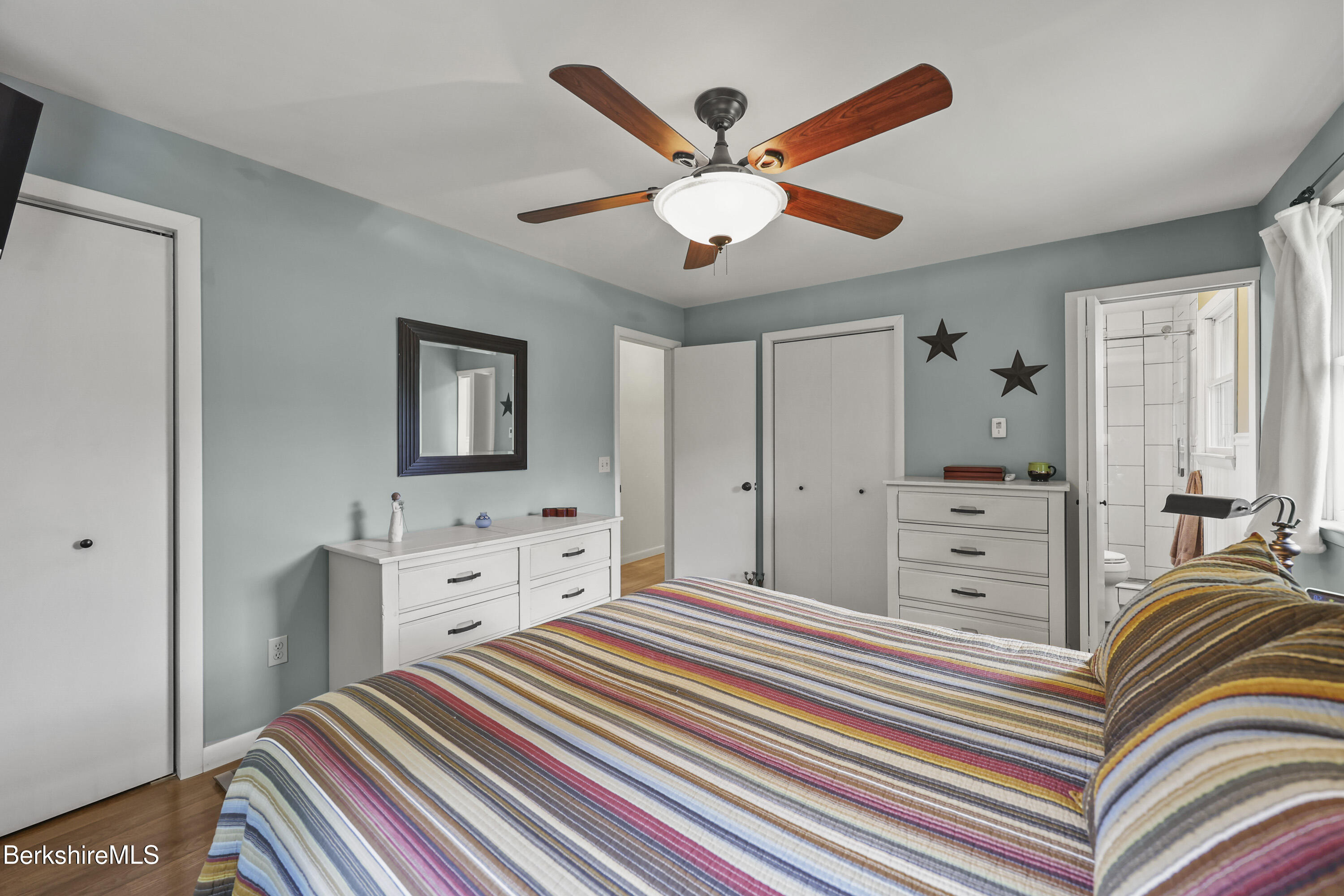 4 Birch Hill Road Peru, MA 01235 - Photo 32 of 76 a bedroom with a bed and a chandelier