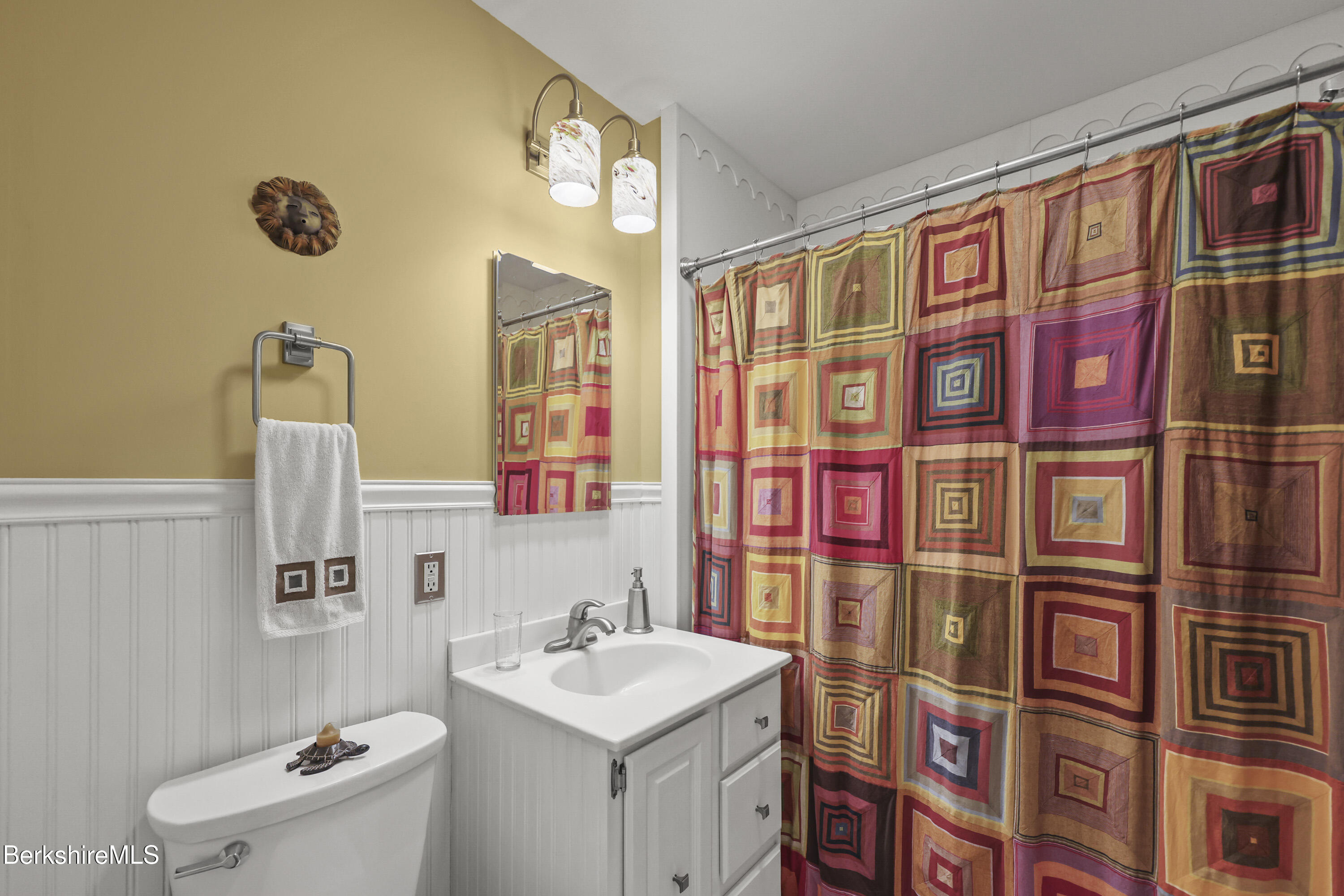 4 Birch Hill Road Peru, MA 01235 - Photo 38 of 76 a bathroom with a sink a toilet and shower curtain
