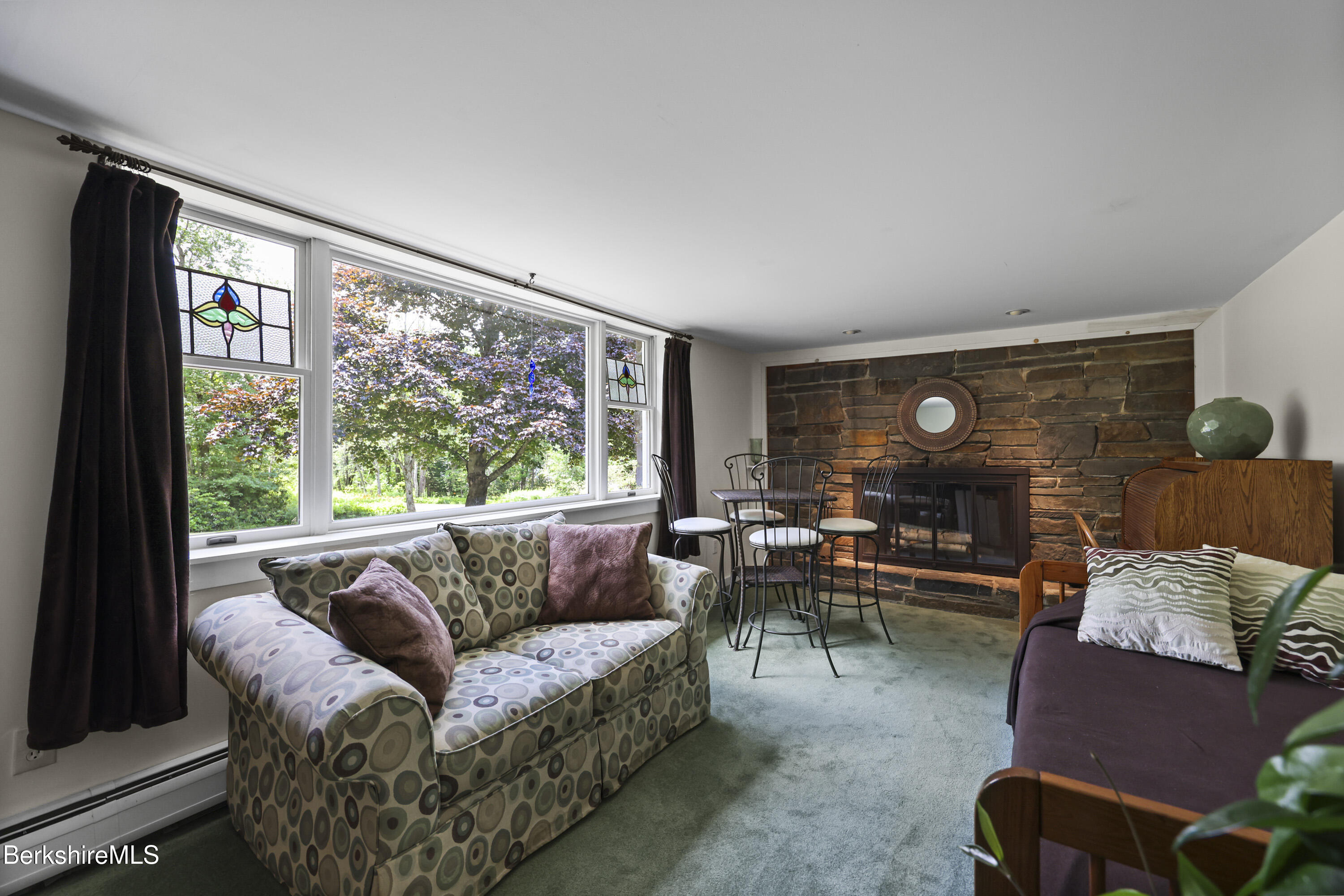 4 Birch Hill Road Peru, MA 01235 - Photo 39 of 76 a living room with furniture and a large window