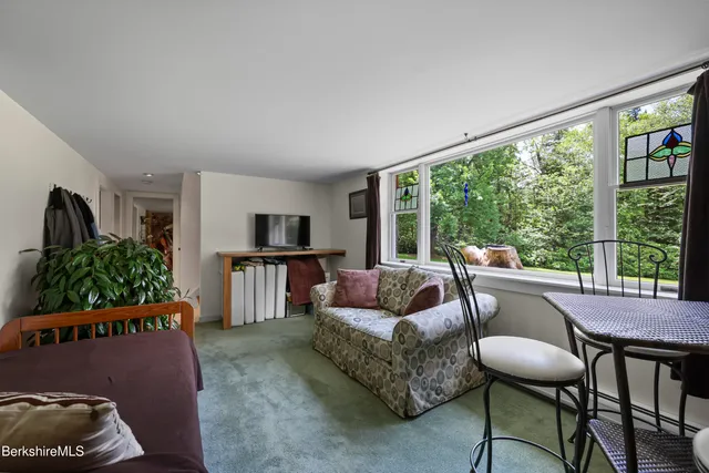 a view of a garden with a house