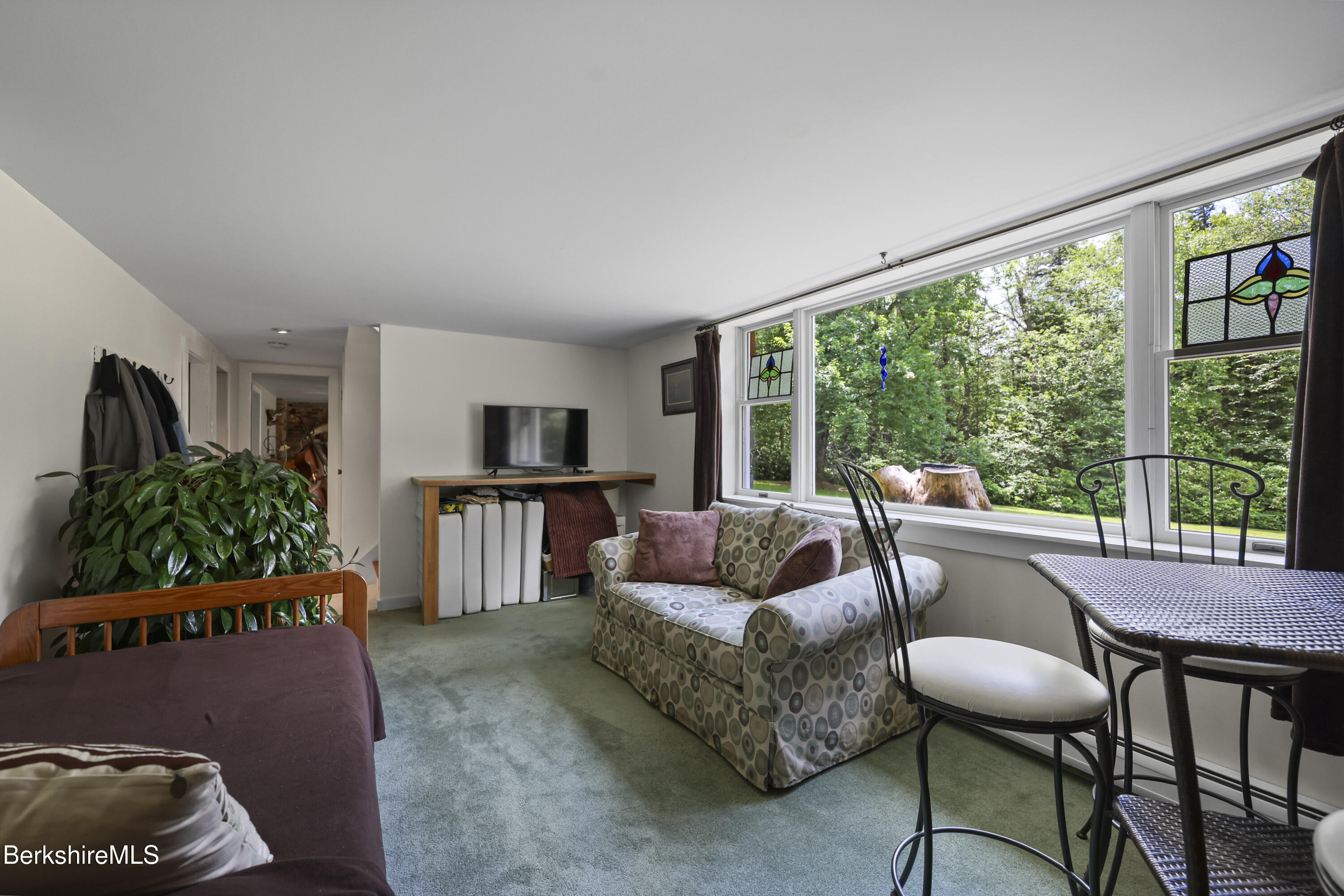 4 Birch Hill Road Peru, MA 01235 - Photo 42 of 76 a living room with furniture and a floor to ceiling window