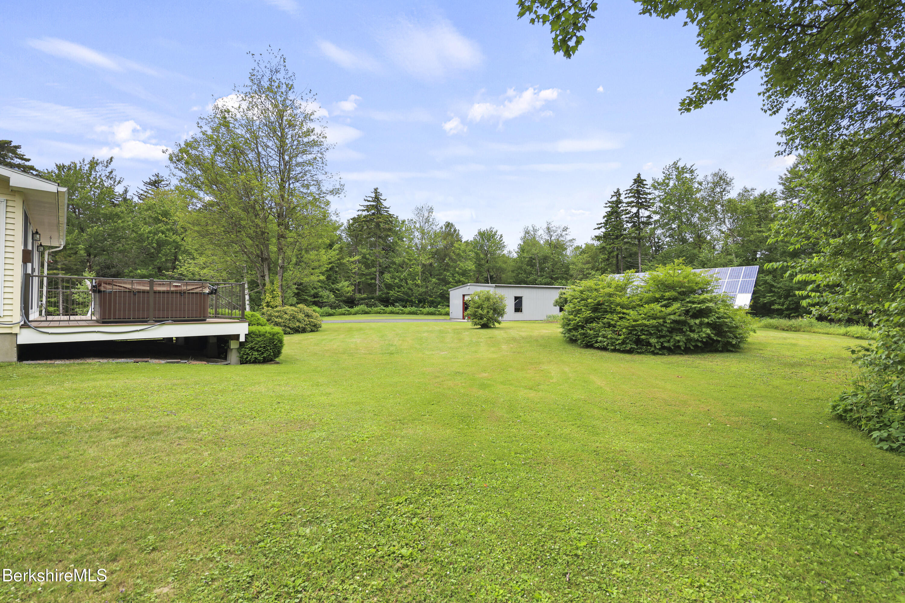 4 Birch Hill Road Peru, MA 01235 - Photo 56 of 76 a view of a garden with a bench