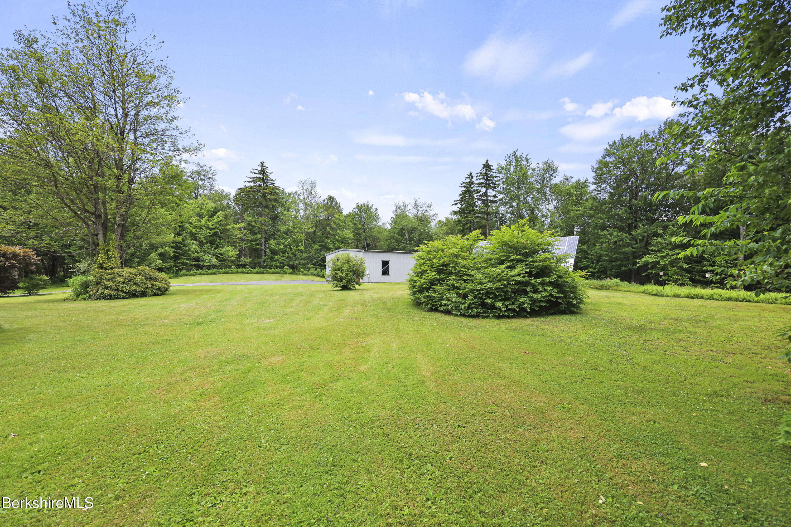 4 Birch Hill Road Peru, MA 01235 - Photo 57 of 76 a view of a garden with a house
