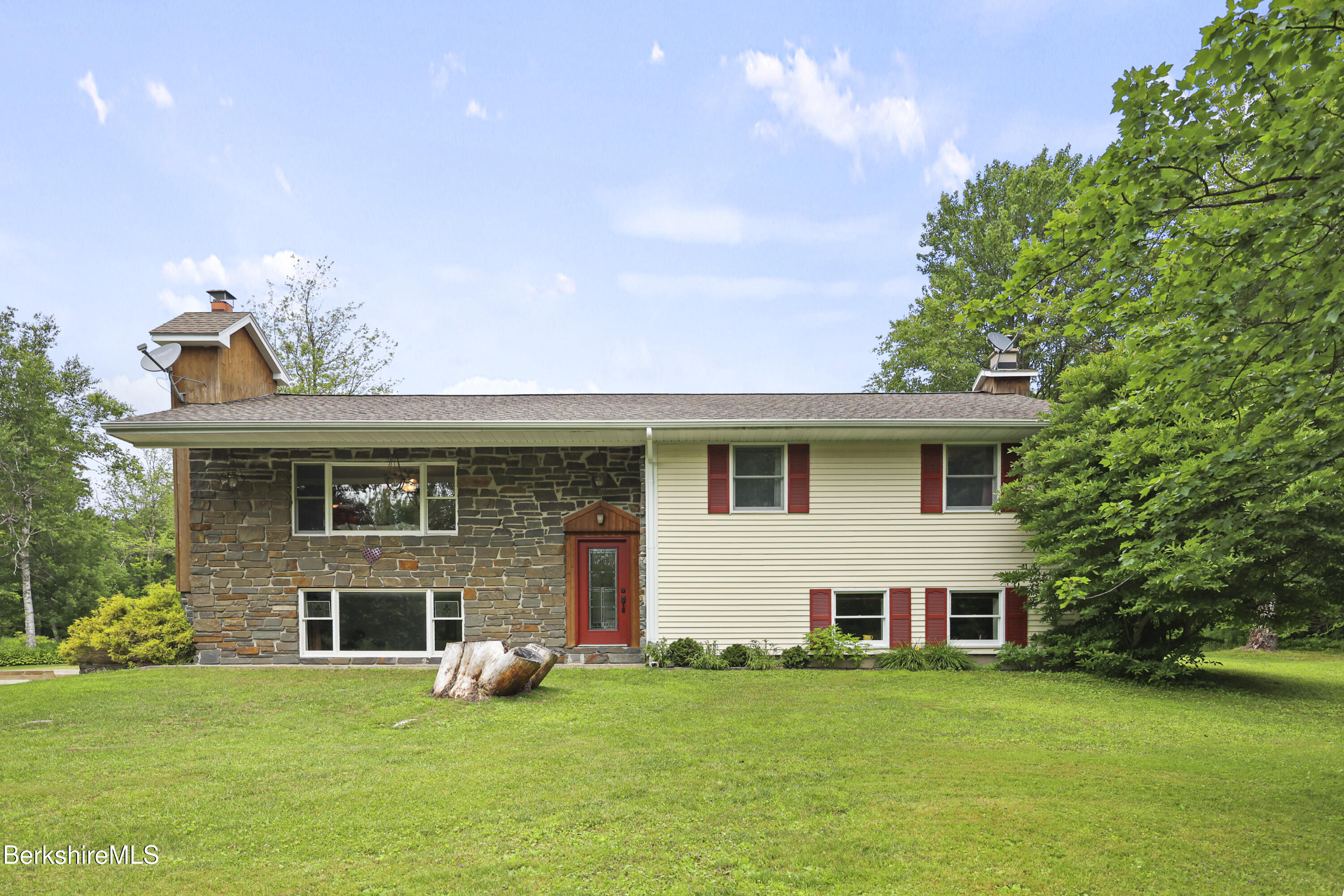 4 Birch Hill Road Peru, MA 01235 - Photo 6 of 76 a front view of a house with a garden and yard