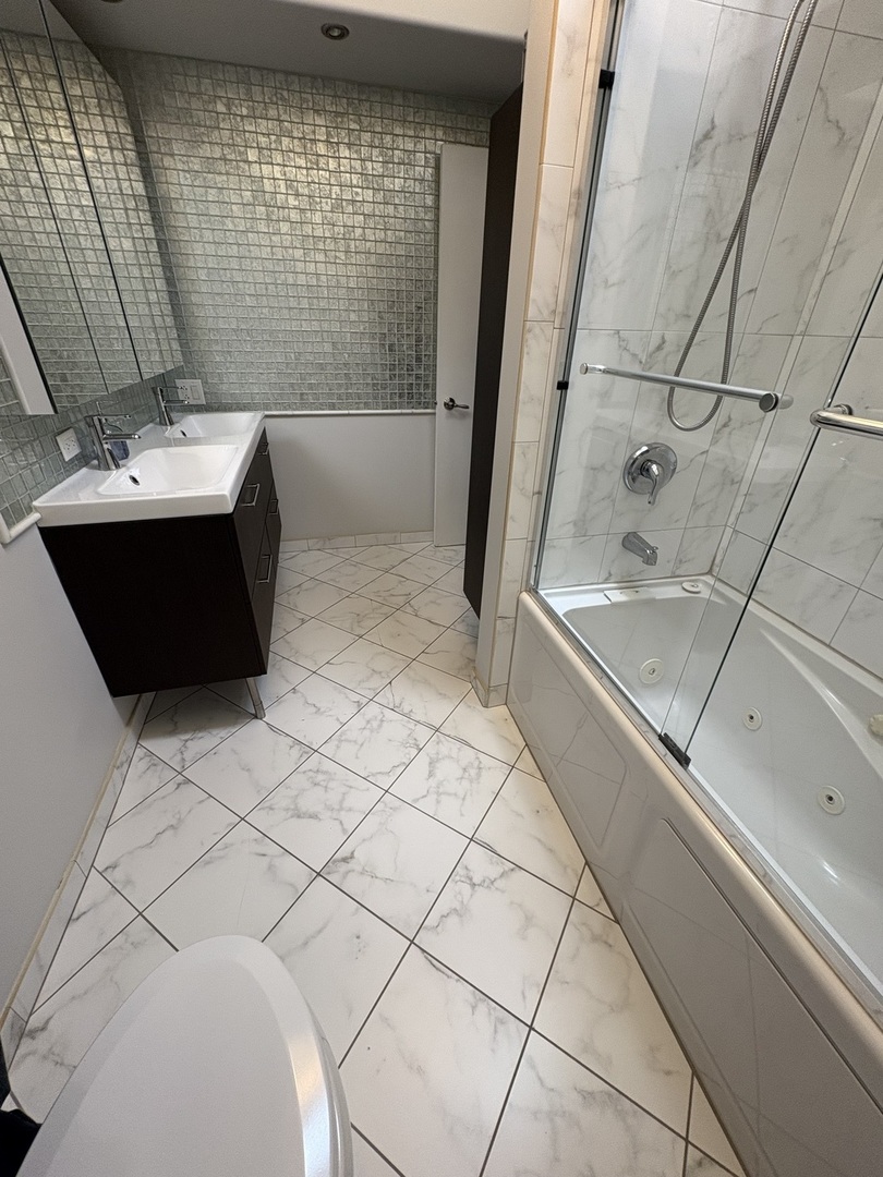 3528 North Neva Avenue Chicago, IL 60634 - Photo 17 of 37 a bathroom with a bathtub and shower