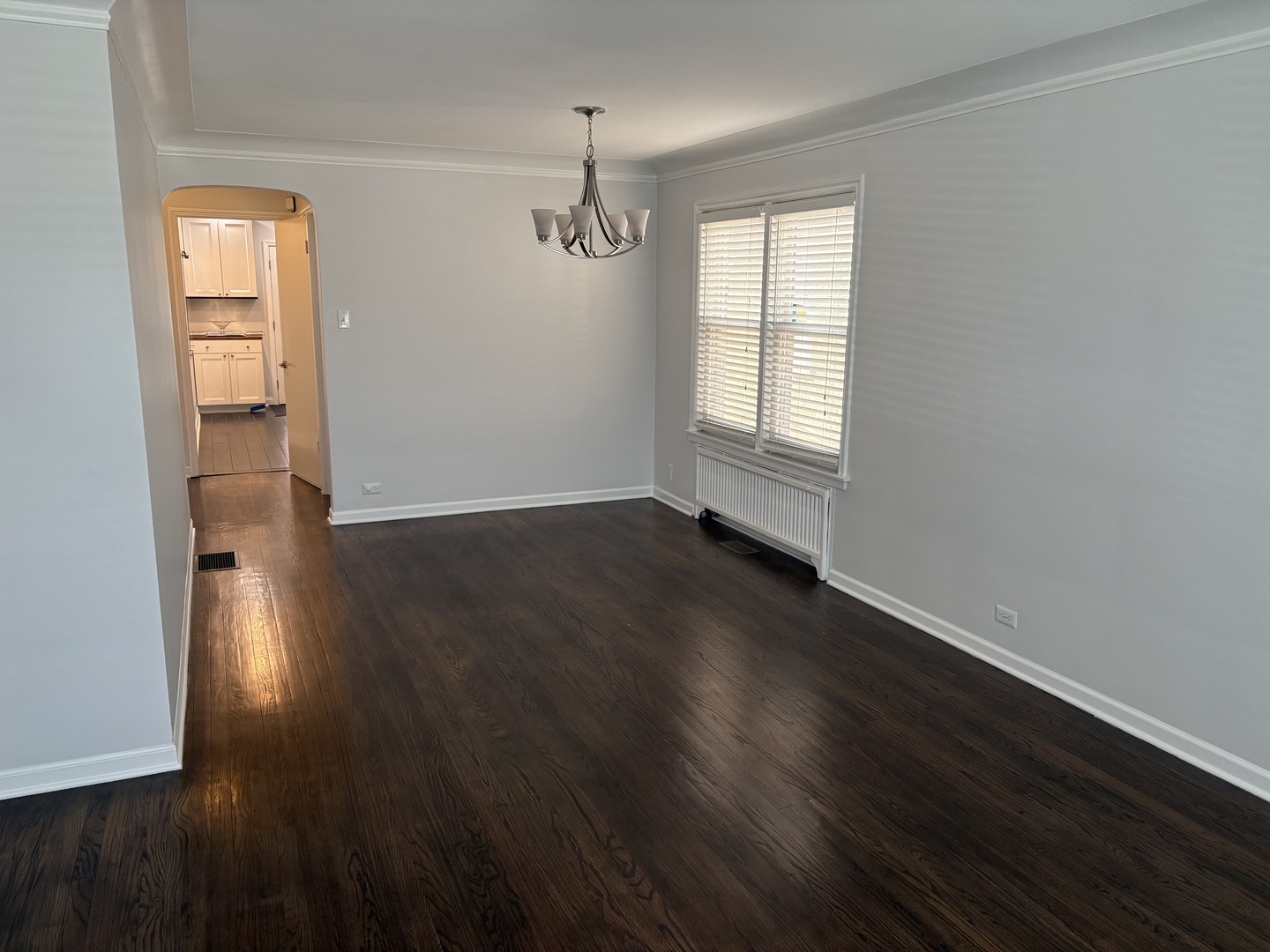3528 North Neva Avenue Chicago, IL 60634 - Photo 2 of 37 an empty room with wooden floor closet and windows