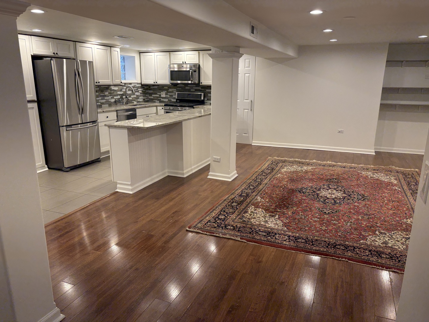 3528 North Neva Avenue Chicago, IL 60634 - Photo 23 of 37 a view of a refrigerator in kitchen and wooden floor