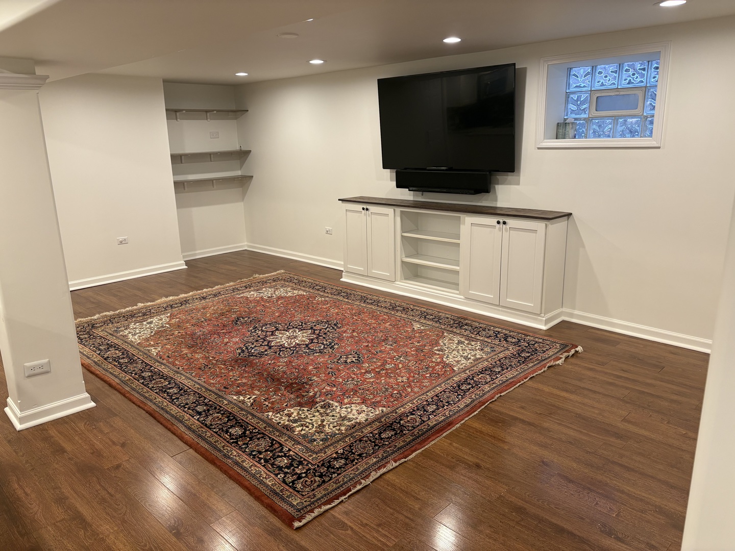 3528 North Neva Avenue Chicago, IL 60634 - Photo 25 of 37 a living room with a flat screen tv and a rug
