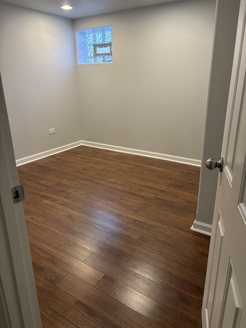 3528 North Neva Avenue Chicago, IL 60634 - Photo 28 of 37 a view of a room with wooden floor