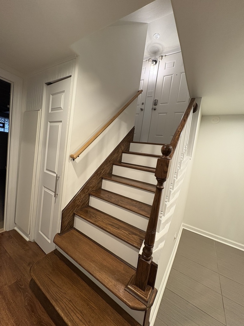 3528 North Neva Avenue Chicago, IL 60634 - Photo 33 of 37 a view of staircase with wooden floor and fan