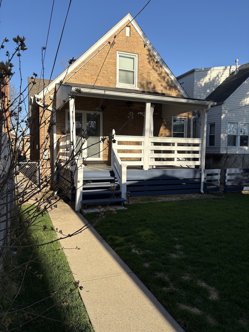 3528 North Neva Avenue Chicago, IL 60634 - Photo 34 of 37 a front view of a house with a garden