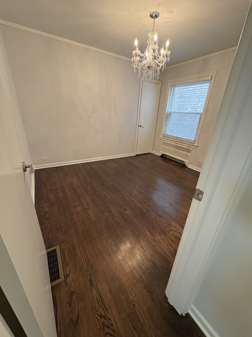 3528 North Neva Avenue Chicago, IL 60634 - Photo 8 of 37 a view of a livingroom with wooden floor