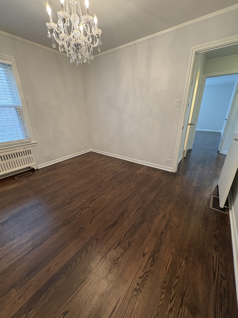 3528 North Neva Avenue Chicago, IL 60634 - Photo 9 of 37 a view of a livingroom with wooden floor