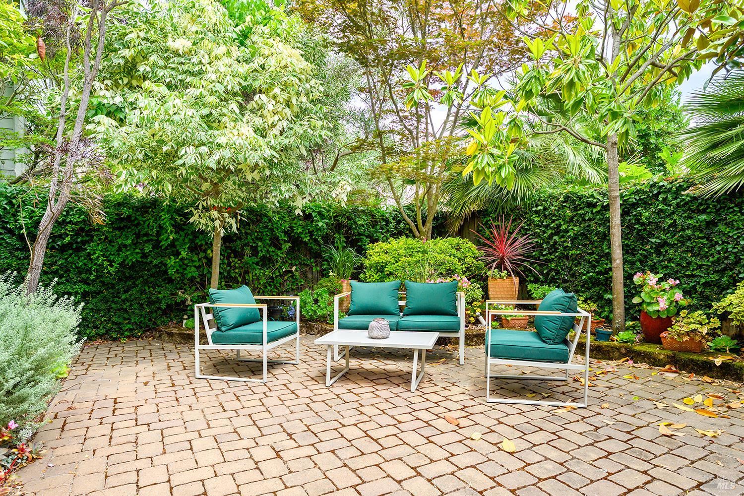 38 Maybeck Street Novato, CA 94949 - Photo 44 of 47 a chair and table in a backyard
