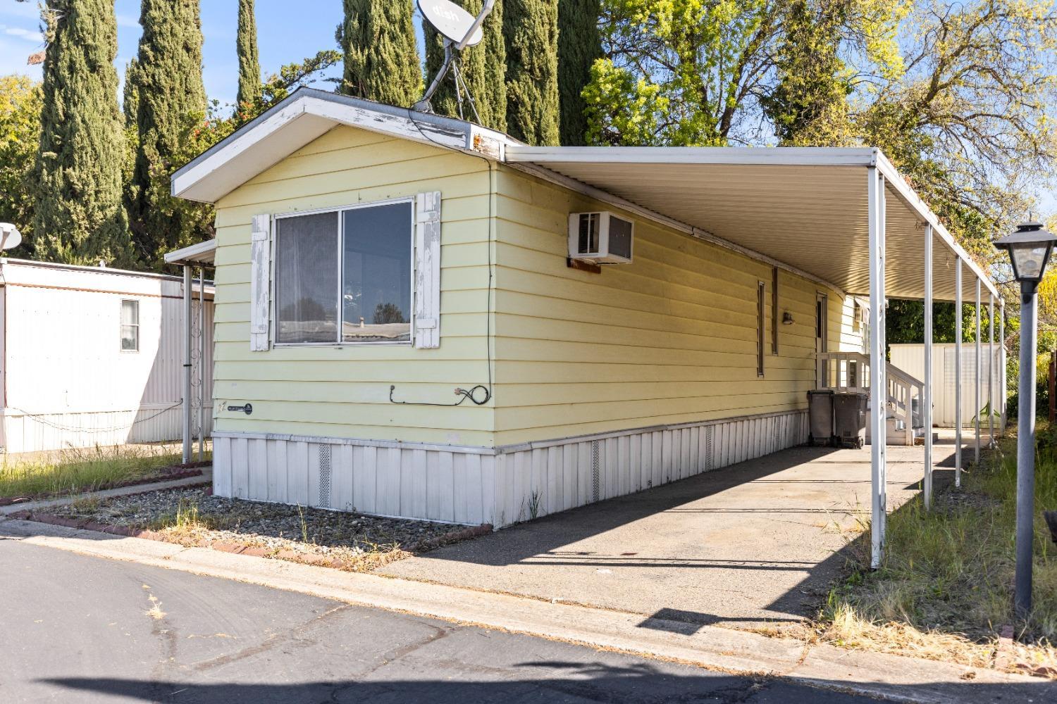417 Westacre Road, Unit 22 West Sacramento, CA 95691 - Photo 3 of 4 a view of a house with a wooden fence