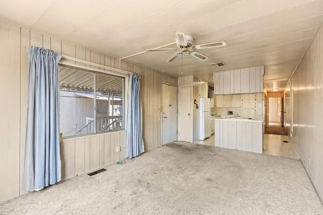 a view of a kitchen with a sink and cabinet area