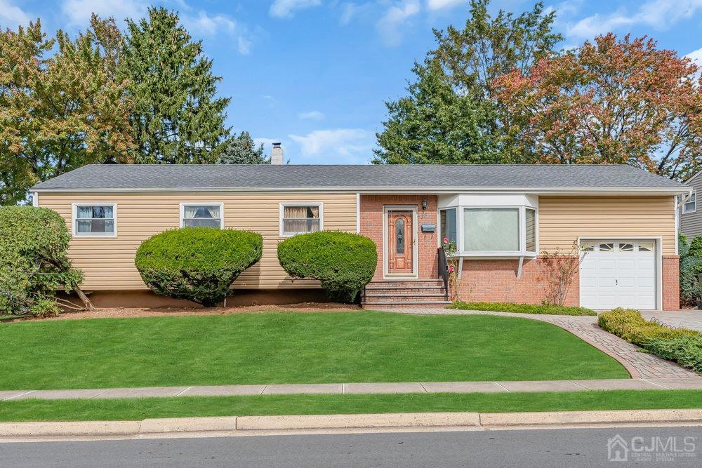 13 Eardley Road Edison, NJ 08817 - Photo 1 of 35 a view of a house with a yard and plants