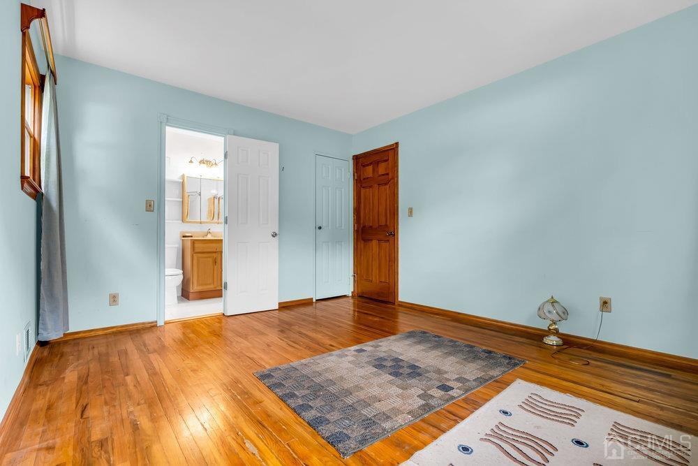 13 Eardley Road Edison, NJ 08817 - Photo 14 of 35 a view of a room with wooden floor and closet