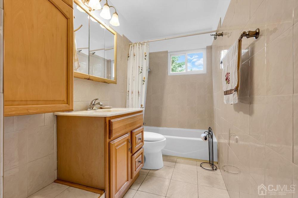 13 Eardley Road Edison, NJ 08817 - Photo 17 of 35 a bathroom with a sink toilet and shower