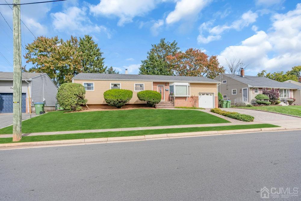13 Eardley Road Edison, NJ 08817 - Photo 2 of 35 a view of a house with a big yard and potted plants