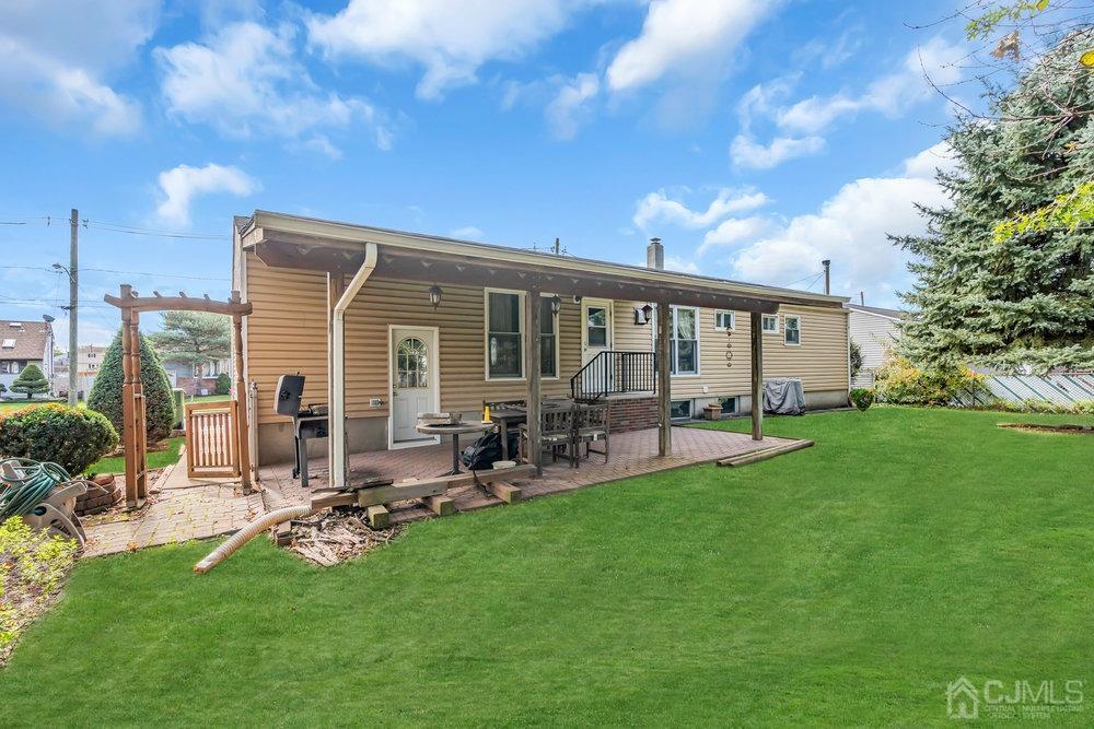13 Eardley Road Edison, NJ 08817 - Photo 25 of 35 a view of a house with backyard porch and sitting area
