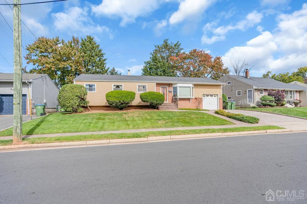 13 Eardley Road Edison, NJ 08817 - Photo 32 of 35 a view of house with outdoor space and parking