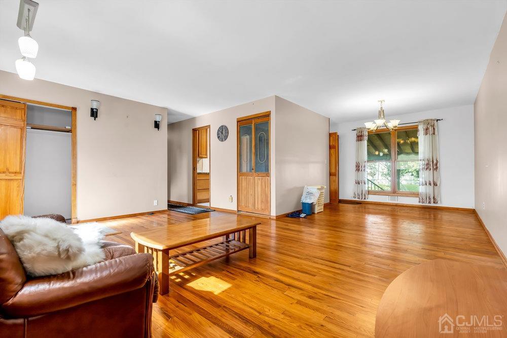 13 Eardley Road Edison, NJ 08817 - Photo 5 of 35 a living room with furniture and wooden floor