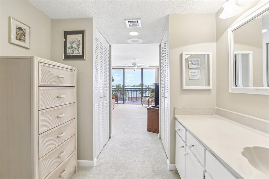1 Key Capri, Unit 302E Treasure Island, FL 33706 - Photo 17 of 29 a bathroom with a tub sink and vanity