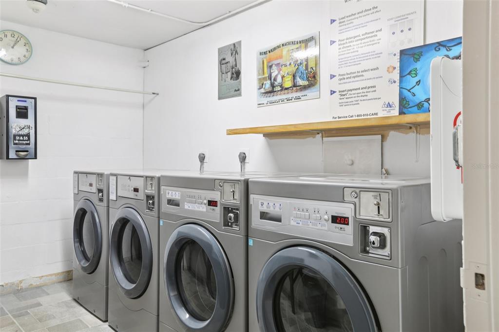 1 Key Capri, Unit 302E Treasure Island, FL 33706 - Photo 25 of 29 a utility room with dryer and washer
