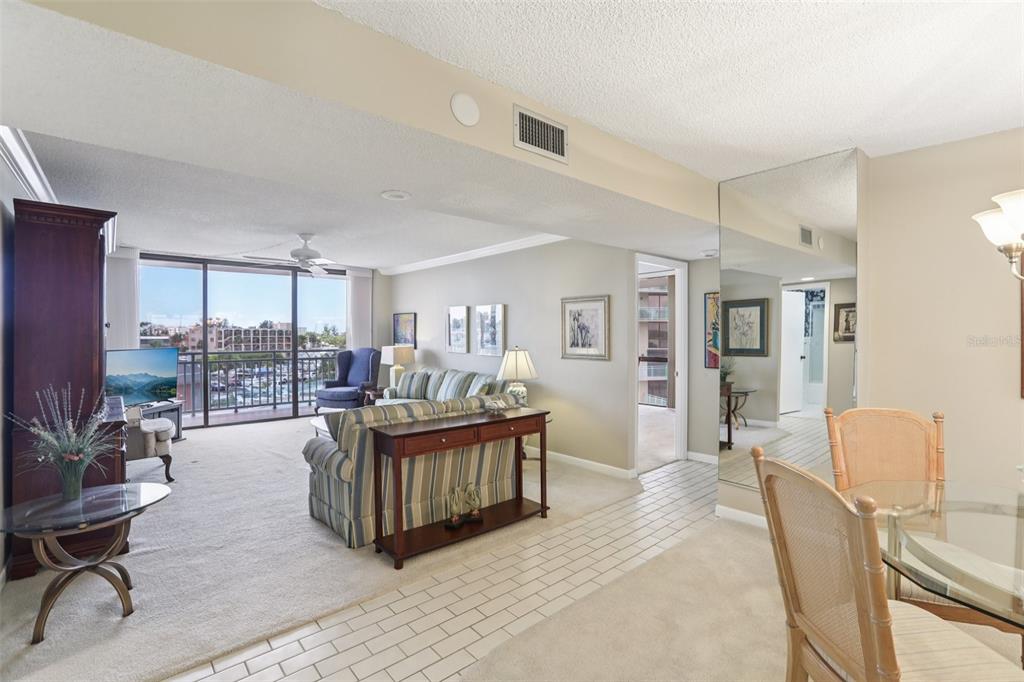 1 Key Capri, Unit 302E Treasure Island, FL 33706 - Photo 5 of 29 a living room with furniture and a large window