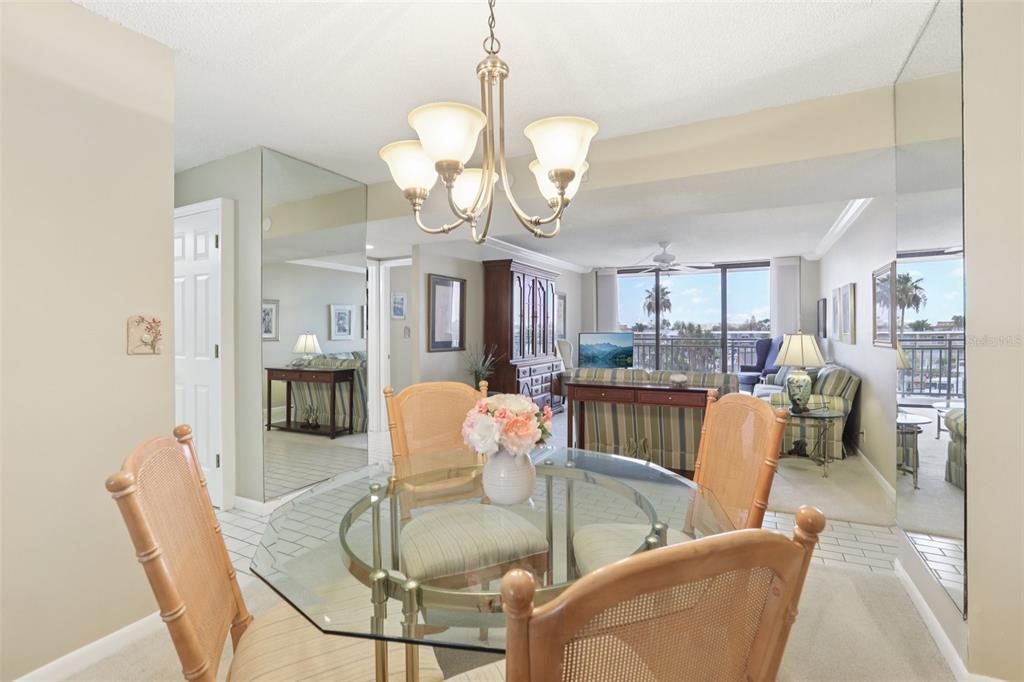 1 Key Capri, Unit 302E Treasure Island, FL 33706 - Photo 6 of 29 a dining room filled with furniture