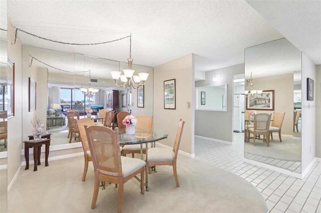 1 Key Capri, Unit 302E Treasure Island, FL 33706 - Photo 8 of 29 a dining room with furniture and window