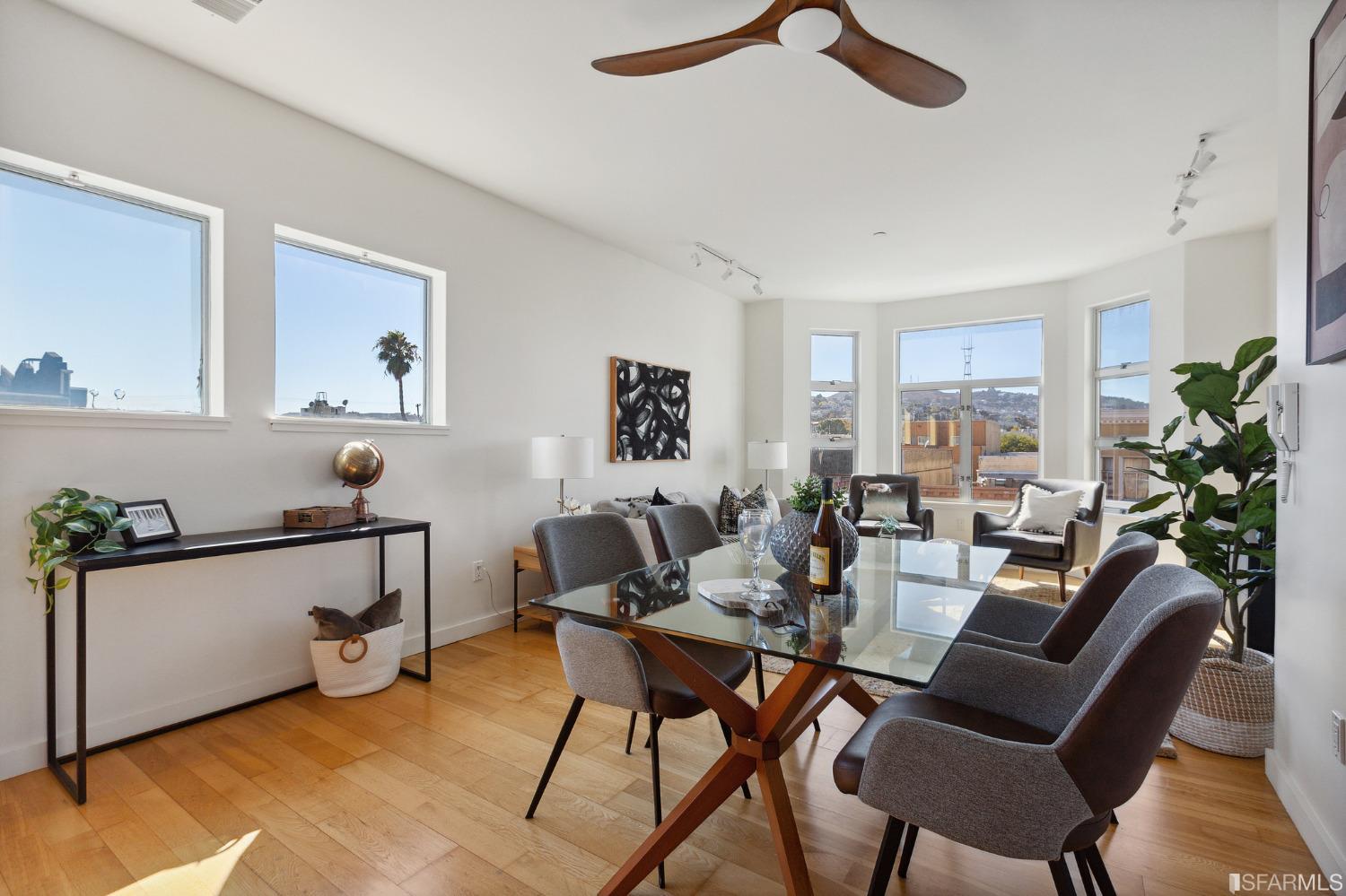 a living room with furniture a window and potted plant