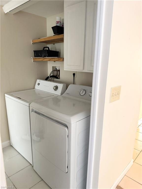 124 Cypress Way East, Unit E3 Naples, FL 34110 - Photo 14 of 22 a utility room with dryer and washer