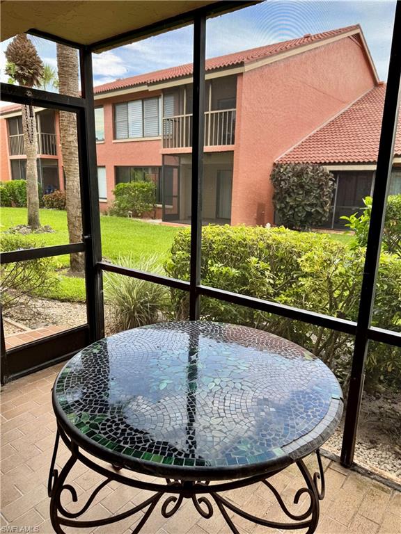 124 Cypress Way East, Unit E3 Naples, FL 34110 - Photo 15 of 22 a view of a balcony dining area