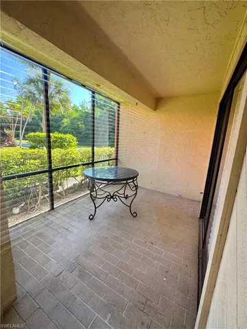 a view of a room with large windows