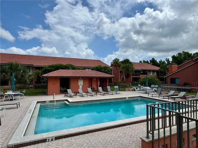 a view of a swimming pool with a patio