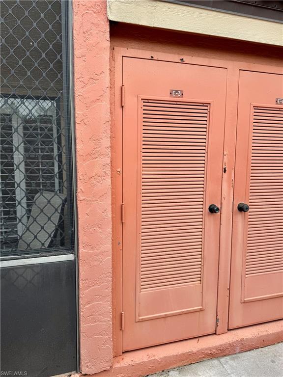 124 Cypress Way East, Unit E3 Naples, FL 34110 - Photo 20 of 22 a view of front door