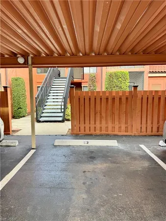 a view of outdoor space with wooden wall