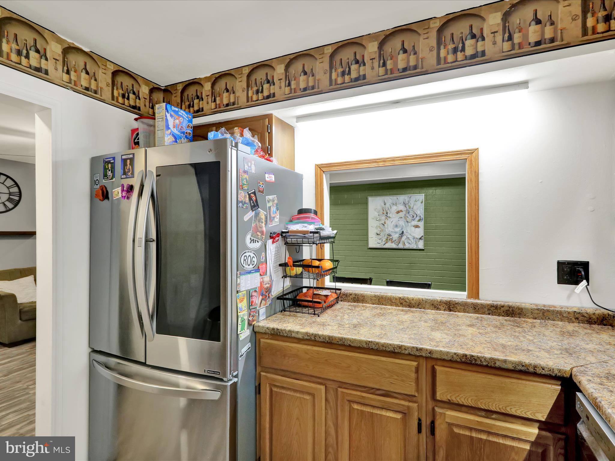 1212 Deer Run Reading, PA 19606 - Photo 11 of 29 a kitchen with stainless steel appliances granite countertop a refrigerator and a sink