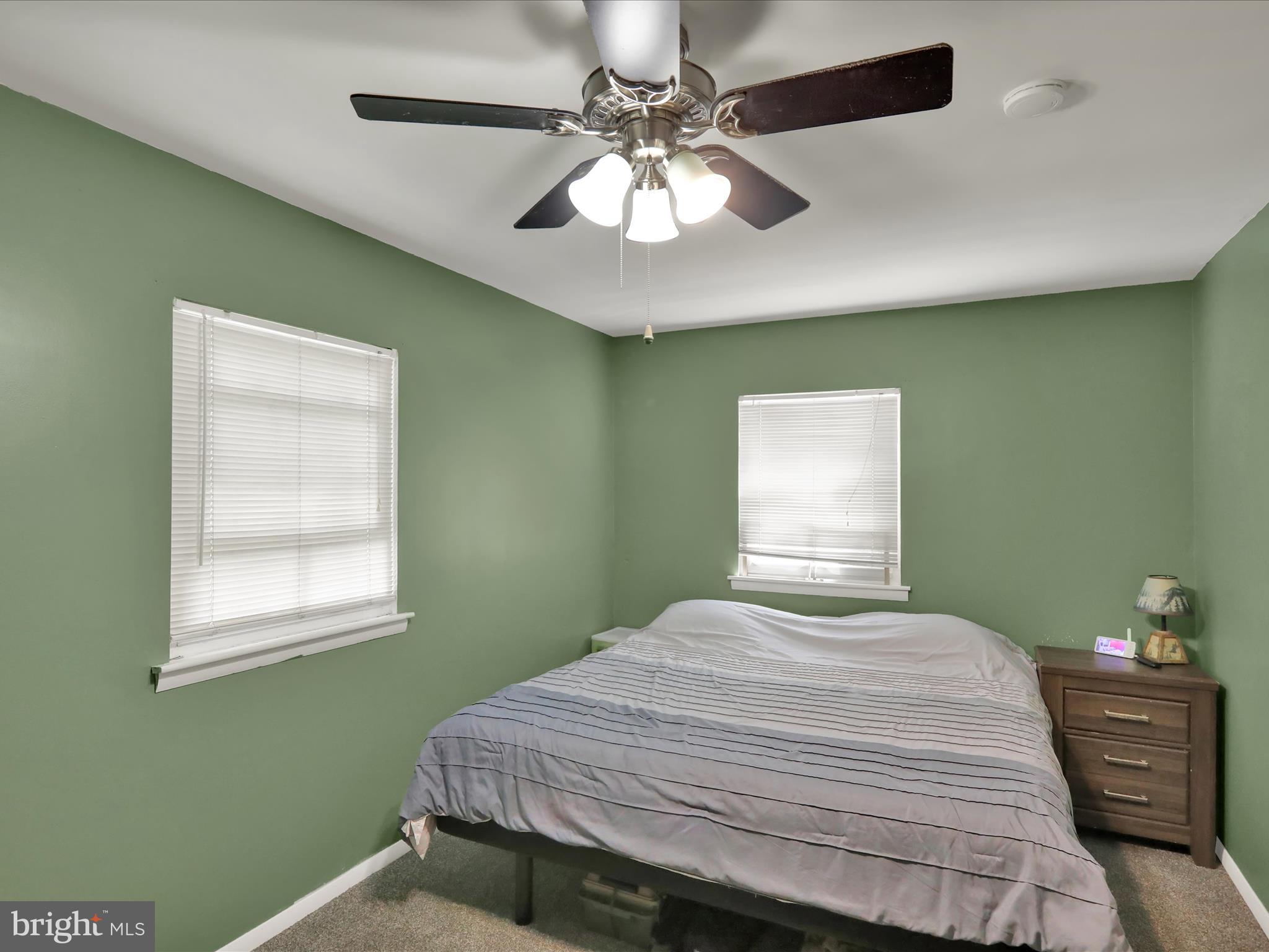 1212 Deer Run Reading, PA 19606 - Photo 13 of 29 a bedroom with a bed and a chandelier