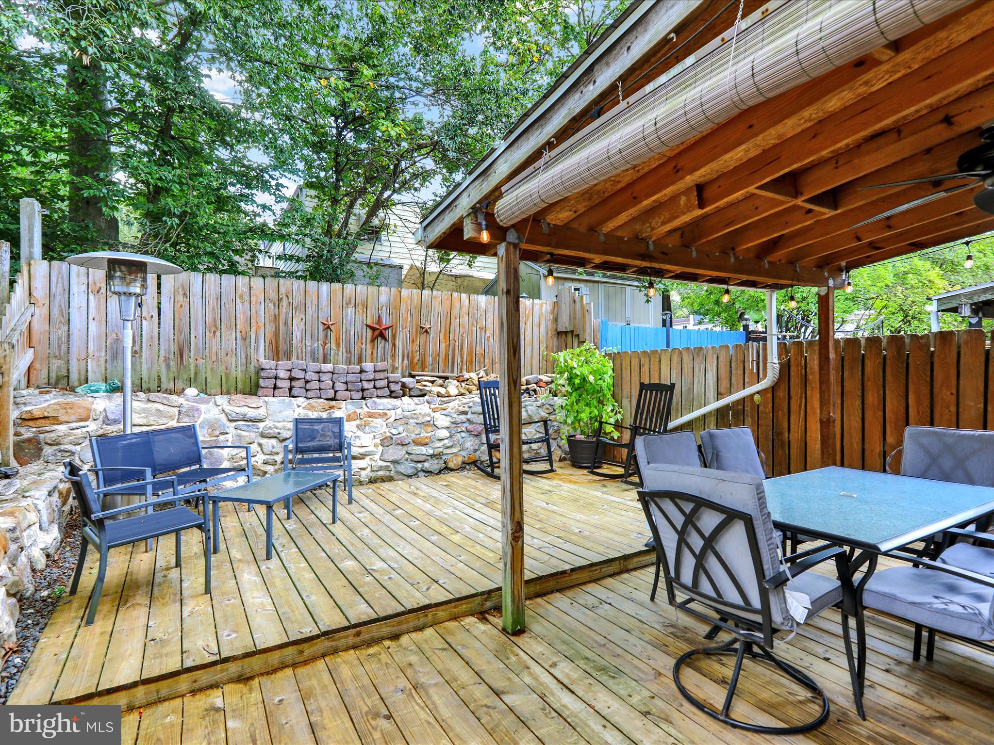 1212 Deer Run Reading, PA 19606 - Photo 24 of 29 a view of patio with table and chairs and wooden floor