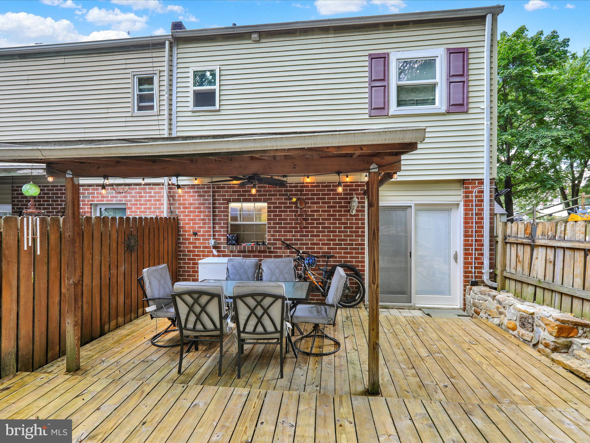 1212 Deer Run Reading, PA 19606 - Photo 25 of 29 a view of a patio with table and chairs and wooden floor